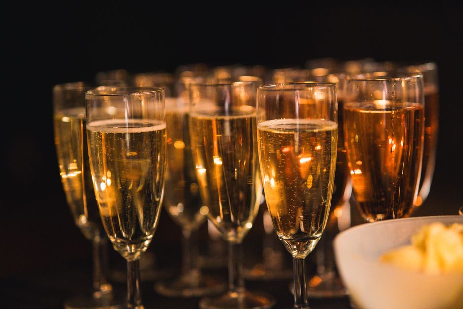 Champagne glasses toast for a plated dinner